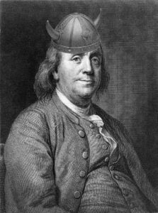 Benjamin Franklin with operatic Viking horns. 